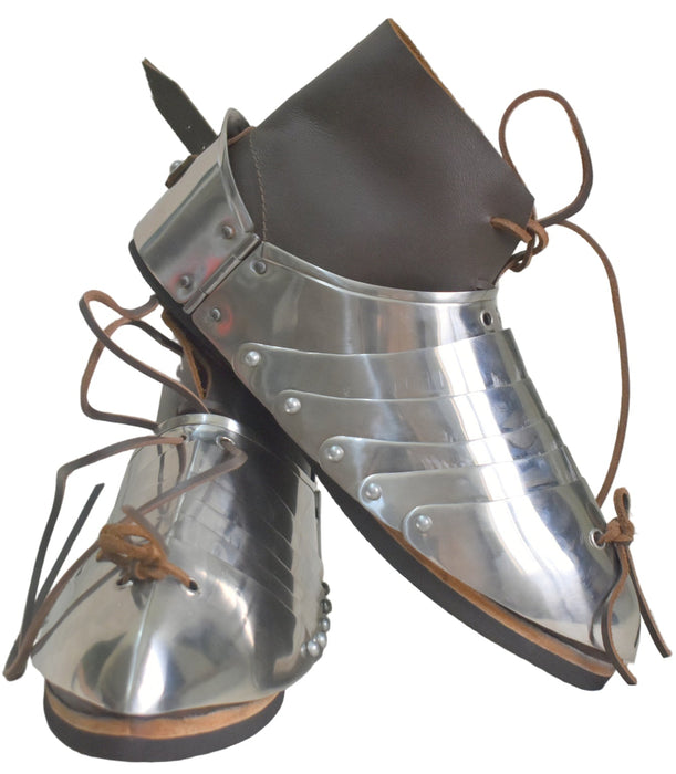 Pair of metallic sabaton pair with leather boots on a white background, branded 'Honour Kraft'.