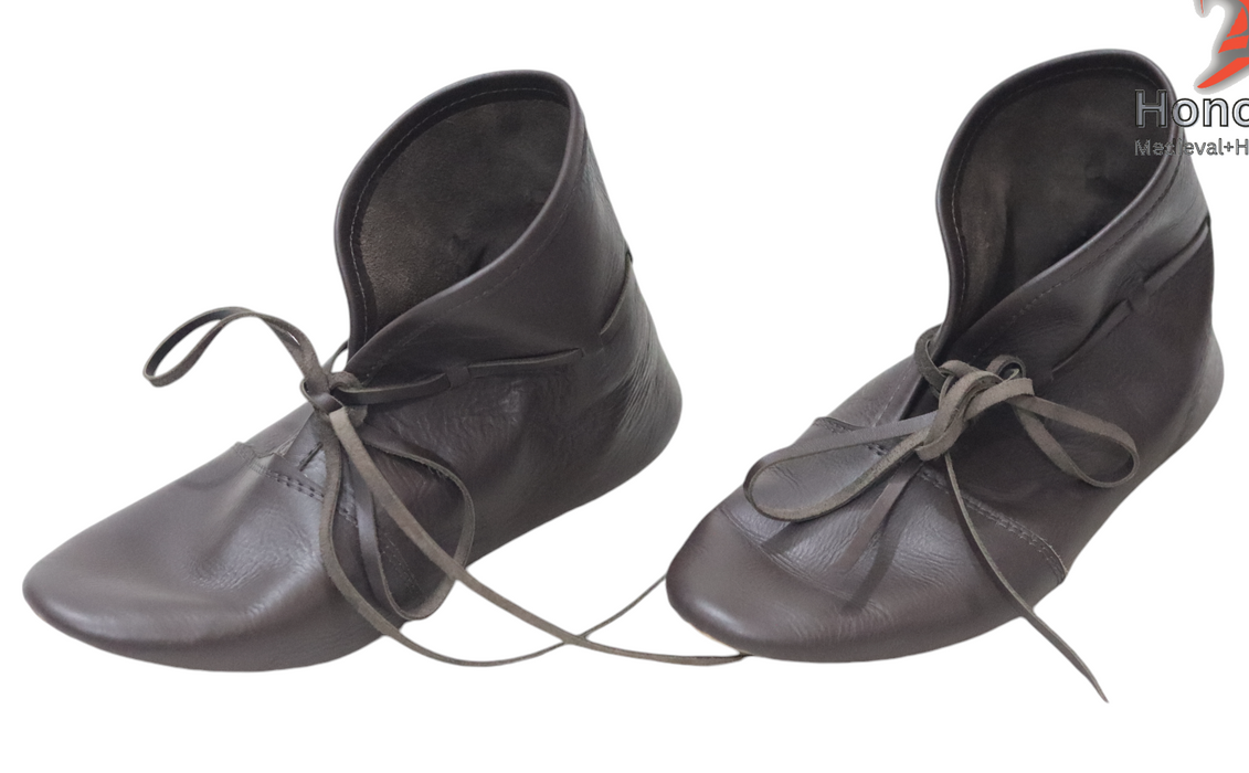 Pair of gray leather shoes with laces on a white background, branded 'Honour Craft'.